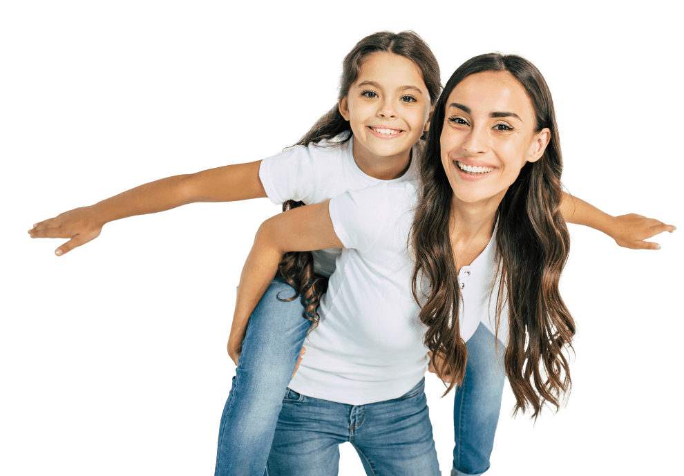 A woman giving a piggyback ride to a girl
